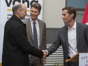 Vancouver's first modular housing project was officially opened Thursday, February 16, 2017 by mayor Gregor Robertson (centre), Minister of Families, Children and Social Development for Canada Jean-Yves Duclos (left) and Vancouver Affordable Housing Agency CEO Luke Harrison (right), at 220 Terminal Avenue.