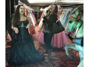 Julianna Lukan tries on a dress with her mother Tracy Roy at the Cinderella Project's 18th annual Boutique day in Vancouver on Sunday.