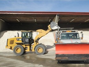 Salt trucks are loaded at the City of Vancouver works yard on Thursday, in preparation for forecast snowstorms.