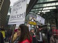 Hundreds protest the official opening of the Trump Tower in Vancouver, BC. February 28, 2017.