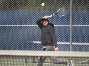 Jordan Patterson plays tennis at Stanley Park in Vancouver on Tuesday.