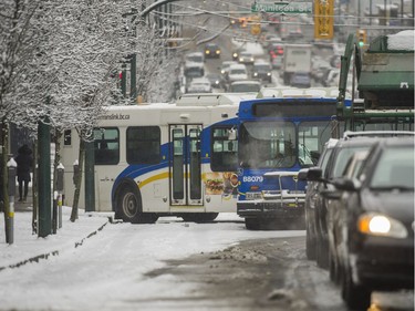 A bus is stuck on Broadway near Manitoba during Friday's snowstorm.