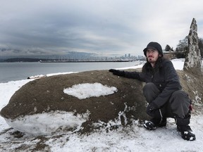 Aaron Cambrin with his snow and sand sculptures of orcas at Jericho Beach in Vancouver, BC., February 6, 2017.