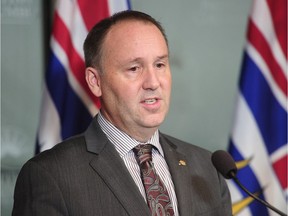 B.C. Education Minister Mike Bernier talks to reporters on Oct. 17, the day he announced he had fired the Vancouver School Board’s elected trustees.