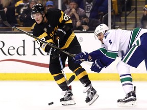 David Pastrnak of the Boston Bruins scored the game-winning goal on this third-period play Saturday after eluding Canuck defenceman Chris Tanev. The Bruins defeated the Canucks 4-3 at the TD Garden in Boston, Mass.