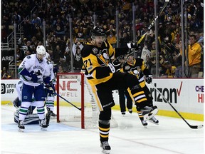 Evgeni Malkin celebrates after scoring the opening goal against the Canucks.