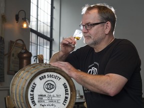 VANCOUVER February 08 2017.  Odd Society Spirits distiller Gordon Glanz smells the soon to be released 3 year old Maple Whisky Vancouver, February 08 2017.  .Gerry Kahrmann  /  PNG staff photo) ( Prov / Sun News) 00047772A Story by Joanne Sasvari [PNG Merlin Archive]