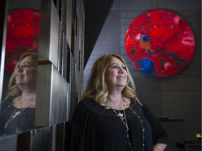 Miriam Aroeste with her painting, Life Is On, in the lobby of the Trump Hotel, Vancouver, February 24 2017.