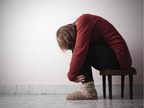 A woman sitting alone.