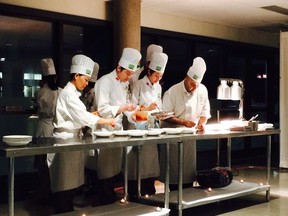 The Chef's Table at Vancouver Community College. Here, students with Chef Hamid Salimian.