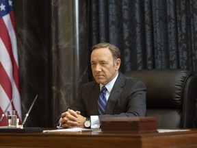 This image released by Netflix shows Kevin Spacey as Francis Underwood in a scene from "House of Cards." Spacey was nominated for a Golden Globe for best actor in a drama series for his role on the show on Thursday, Dec. 11, 2014. The 72nd annual Golden Globe awards will air on NBC on Sunday, Jan. 11. (AP Photo/Netflix, Nathaniel E. Bell)