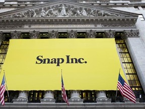FILE - In this March 2, 2017 file photo, a banner for Snap Inc. hangs from the front of the New York Stock Exchange, in New York. Snap‚Äôs stock may be heading for an opening below its first day closing price for the first time as people try to determine the tech company‚Äôs worth. Shares are down more than 3 percent to $23.00 in premarket trading on Tuesday, March 7. (AP Photo/Mark Lennihan)