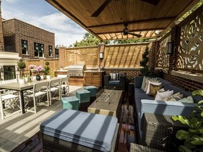 This undated photo provided by Chicago Roof Deck and Garden shows a roof deck in Chicago designed by the Chicago based design-build firm. Urban dwellers are looking up for outdoor living inspiration, installing rooftop decks complete with kitchens, lounges, gardens and entertaining spaces. (Chicago Roof Deck and Garden via AP)