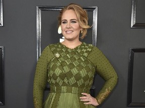 FILE - In this Feb. 12, 2017 file photo, Adele arrives at the 59th annual Grammy Awards in Los Angeles. Celebrities are using social media to express their support for International Women‚Äôs Day. Adele Tweeted, ‚ÄúWhatever women do they must do twice as well as men to be thought half as good. Luckily, this is not difficult&ampquot; (Photo by Jordan Strauss/Invision/AP, File)