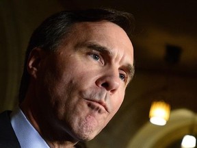 Minister of Finance Bill Morneau talks to reporters in the foyer of the House of Commons on Parliament Hill in Ottawa on Tuesday, March 7, 2017. Expectations are running high that next week&#039;s federal budget will provide a more detailed federal strategy — and perhaps more cash — to help post-secondary students land real-life work experience in emerging, employee-starved fields. THE CANADIAN PRESS/Sean Kilpatrick