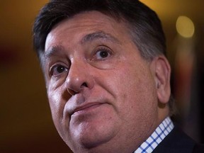 Ontario Finance Minister Charles Sousa pauses during a news conference after reaching a deal to expand the Canada Pension Plan, in Vancouver, B.C., on Monday June 20, 2016. Sousa is urging Ottawa to address speculative investing in the country&#039;s housing markets by changing how such profits are taxed. THE CANADIAN PRESS/Darryl Dyck
