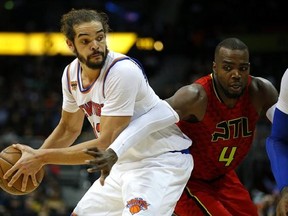 FILE - In this Jan. 29, 2017 file photo, New York Knicks center Joakim Noah (13) looks to pass as Atlanta Hawks forward Paul Millsap (4) is defending in the first overtime of an NBA basketball game in Atlanta. Noah has been suspended 20 games without pay for violating the league&#039;s anti-drug policy. The NBA announced the suspension Saturday, March 25 saying Noah tested positive for Selective Androgen Receptor Modulator LGD-4033 _ something found in some over-the-counter supplements. (AP Photo/Tod