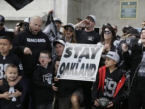 Oakland Raiders fans gather for a picture before the start of a rally to keep the team from moving Saturday, March 25, 2017, in Oakland, Calif. NFL owners are expected to vote on the team&#039;s possible relocation to Las Vegas on Monday or Tuesday at their meeting in Phoenix. (AP Photo/Eric Risberg)