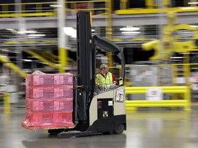 FILE - In this Feb. 13, 2015, file photo, a forklift operator moves a pallet of goods at an Amazon.com fulfillment center in DuPont, Wash. The Middle East&#039;s biggest online retailer Souq.com has been bought by Amazon on Tuesday, March 28, 2017, for an undisclosed amount, a day after a counteroffer of $800 million from the operator of Dubai&#039;s biggest mall became public. Souq.com and Amazon issued a joint statement in Dubai announcing the sale, saying it represents Amazon&#039;s entry into the Middle Ea