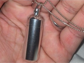 A silver chain and pendant was stolen from Abbotsford woman's vehicle. The pendant contained a vial which held her grandfather's ashes.