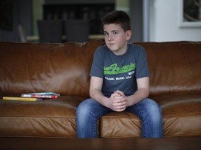 Alec Jones, 14, created an app for Facebook Messenger called Christopher Bot which helps with homework by sending reminders about when assignments are due. Jones poses for a photo at his home in Victoria, B.C., on Friday, March 10, 2017.