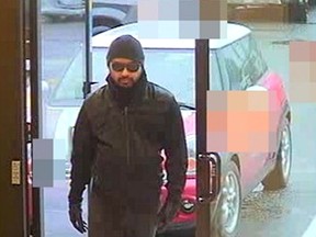 A surveillance camera captured this image of a suspect in an Abbotsford bank robbery on March 17.