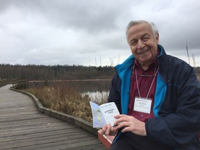 Rick Hankin, a director with the Pacific Parklands Foundation, shows off his regional parks passport at Burnaby Lake Park following the kick-off to Metro Vancouver's celebration of 50 years of regional parks.