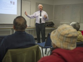 Retired educator Royce Shook holds a recent workshop at MOSAIC Immigrant Society in Burnaby. He provides advice about RRSPs and dealing with retirement.
