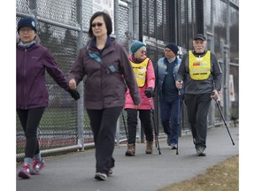 Nordic walker Mike Usinger, right, walks with his Sun Run InTraining group at Burnaby Lakes Sports Complex. He has participated in the Sun Run for the past 15 years.