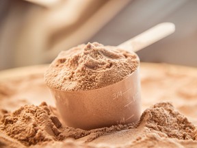 A scoop of whey protein, which is a concentrated, chemically separated protein that comes from dairy products.