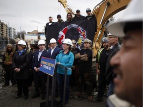 Premier Christy Clark appears with members of the Ironworkers Local 97 at a construction site in Victoria on Wednesday.