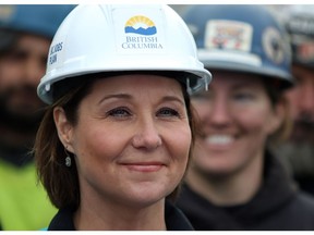 Premier Christy Clark looks on as ironworkers from Local 97 and the union representing more than 1,800 ironworkers in the province announce they are endorsing the Liberals during a press conference at a construction site along Johnston Street in Victoria, B.C., on Wednesday, March 1, 2017.