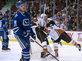 Anaheim Ducks right wing Patrick Eaves (18) celebrates his goal with teammate Antoine Vermette (50) as Vancouver Canucks defenceman Nikita Tryamkin (88) looks on during first period NHL action in Vancouver on Tuesday, March 28, 2017.