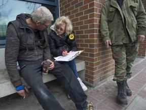 Homeless count volunteer Karen (last name withheld) gathers information from homeless people on the streets of New Westminster, B.C. Wednesday, March 8, 2017.