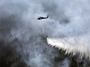 A Bambi Bucket is used to help douse a wildfire in Alaska in 2015.