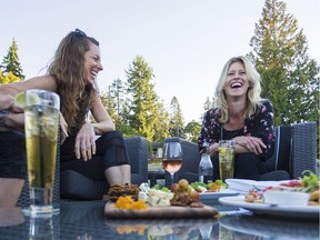 Guests nibble on an array of snacks on the patio at Kingfisher Oceanside Resort & Spa near Courtenary-Comox on Vancouver Island.