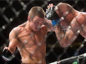 Jeremy Kennedy, left, of Surrey fights Alessandro Ricci, of Woodbridge, Ont., during a lightweight bout during a UFC Fight Night in Vancouver in August 2016.