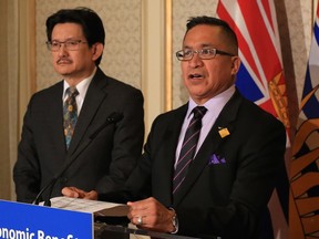 Kitselas First Nation Chief Joe Bevan (right) speaks at the announcement of a benefits agreement with the province backing LNG development in exchange for up to $13 million in funding and a 1,277 land grant. Pacific NorthWest LNG chief operating officer Wan Badrul Hisham is in the background. The event was Thursday, March 30, 2017 at the Fairmont Hotel Vancouver.