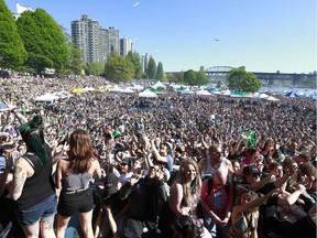 People attend the annual 4/20 marijuana event at it's new location, Sunset Beach, in Vancouver on April 20 2016.