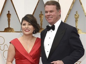 Martha L. Ruiz, left, and Brian Cullinan from PricewaterhouseCoopers at the Oscars in Los Angeles.