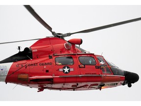 The U.S. Coast Guard has rescued five persons after the same American tug, the 31-metre Ocean Eagle, that ran aground on the B.C. coast just one year ago hit a reef in southeast Alaska. A Coast Guard helicopter is shown in this file photo.