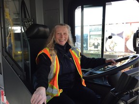 Driver Dee Cooke demonstrates the new barriers that will be installed on all new buses ordered by Coast Mountain Bus Company. Here she has the sliding partition open.