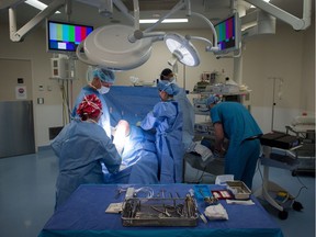 FILE PHOTO A male patient is prepped to have a cyst removed from his right knee at the Cambie Surgery Centre, in Vancouver on Wednesday, August 31, 2016. Dr. Brian Day, a self-styled champion of privatized health care, is bringing his fight to British Columbia Supreme Court for the start of a years-long trial he says is about patients' access to affordable treatment, while his opponents accuse him of trying to gut the core of Canada's medical system.