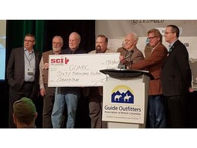 A Safari Club International Facebook posting included a photo of SCI providing the B.C. guide-outfitters with a symbolic $60,000 'grizzly-bear' cheque dated this month.