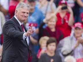 Thirty-three Vancouver Christian leaders wrote a public letter admonishing Graham for saying “Islam is a ‘very evil and wicked religion’" and for “portraying ... U.S. President Donald Trump as intrinsically aligned with the Christian church.” Photo: Graham takes the stage in Alabama.