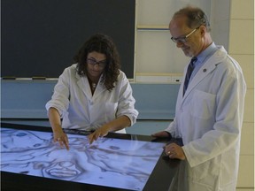 FILE PHOTO UBC head of radiology Bruce Forster (right) demonstrates the new anatomy visualization screen in UBC's gross anatomy lab.