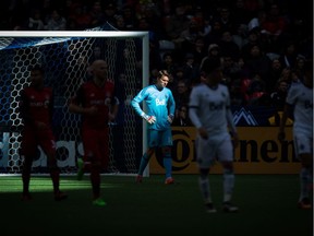 Vancouver Whitecaps goalkeeper Spencer Richey, centre, looks on after allowing a goal to Toronto FC's Victor Vazquez during second half action at B.C. Place on Saturday.