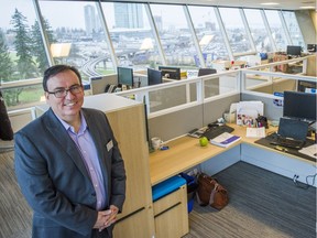 FILE PHOTO: Coast Capital Savings president Don Coulter stands in his open concept office at the company's new headquarters in Surrey, B.C.