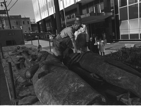 FILE PHOTO The sculpture The Family by Jack Harman being craned into its location in front of the Pacific Press building at 2250 Granville Street on July 6, 1966.