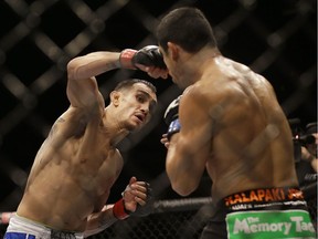 Tony Ferguson, left, is on a nine-match win streak in the UFC, and keeps on racking up the post-fight bonuses.